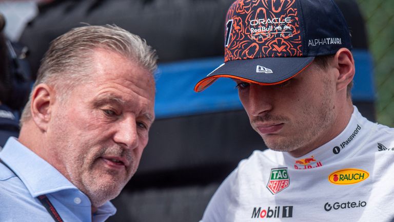 Red Bull Racing's Dutch driver Max Verstappen talks with his father and former F1 driver Jos Verstappen before the start of the Sprint Race of the Formula One Belgian Grand Prix at the Spa-Francorchamps circuit in Spa, on July 26, 2025. (Photo by JONAS ROOSENS / BELGA / AFP) / Belgium OUT