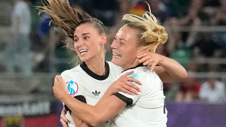 Germany's Jule Brand, 2nd right, celebrates after scoring the opening goal during the Euro 2025, group C, soccer match between Germany and Poland at Arena St. Gallen in St. Gallen, Switzerland, Friday, July 4, 2025. (AP Photo/Martin Meissner)