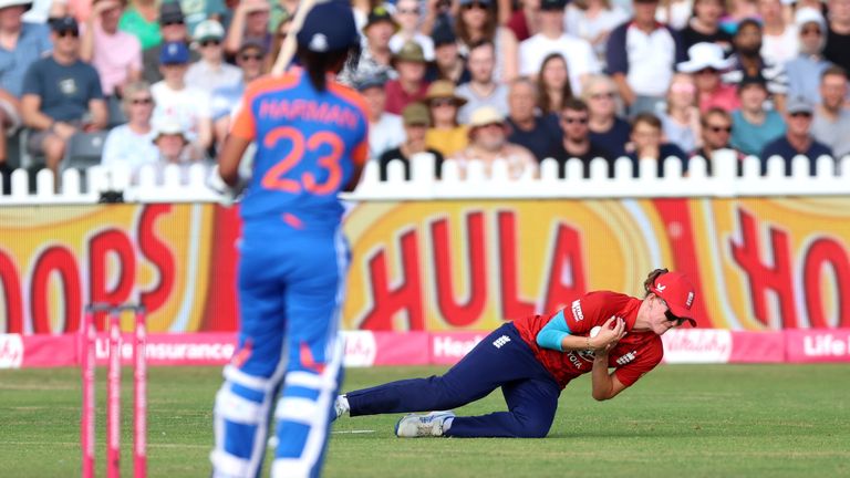 England's Lauren Filer takes a catch to remove India captain Harmanpreet Kaur in the second women's T20I