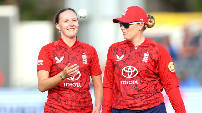 Lauren Filer talks to team-mate Sophie Ecclestone during England's women's T20 vs India