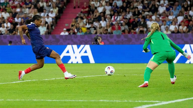 France's Marie-Antoinette Katoto, left, scores the opening goal during the Euro 2025, group D, soccer match between France and England