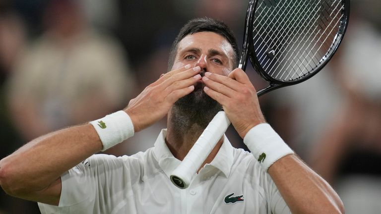Novak...Djokovic...of Serbia celebrates after beating Alexandre Muller of France in their first round men's singles match at the Wimbledon Tennis Championships in London, Tuesday, July 1, 2025. (AP Photo/Kin Cheung)