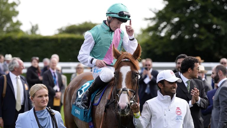 Richard Kingscote takes the acclaim of the Goodwood crowd after steering home Qirat