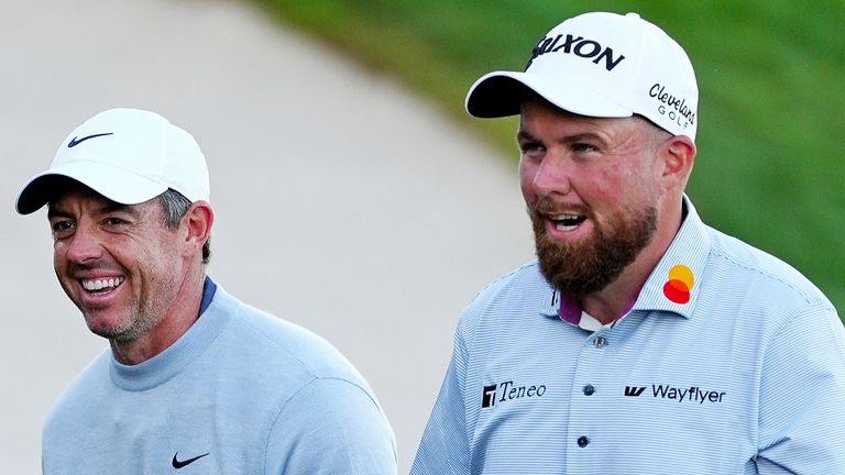 ORLANDO, FL - MARCH 06: From left to right PGA golfers Rory McIlroy and Shane Lowry walk together after finishing on the 18th hole during the first round of the Arnold Palmer Invitational presented by Mastercard on March 6, 2025, at the Arnold Palmer's Bay Hill Club & Lodge in Orlando, Florida. (Photo by Brian Spurlock/Icon Sportswire) (Icon Sportswire via AP Images)