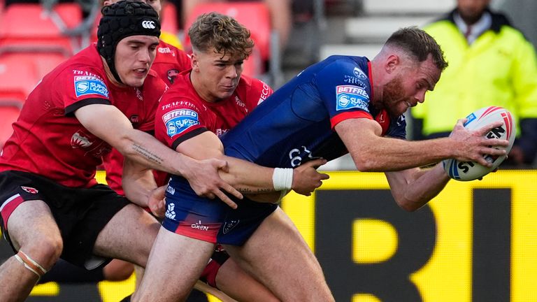Hull KR's Joe Burgess scores a try against Salford Red Devils