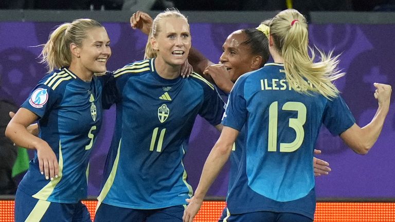 Sweden's Stina Blackstenius, second left, celebrates after scoring the opening goal against Poland in the Euro 2025 Group C match