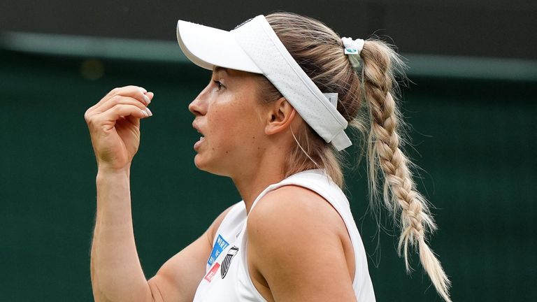 Yulia Putintseva reacts while competing at Wimbledon
