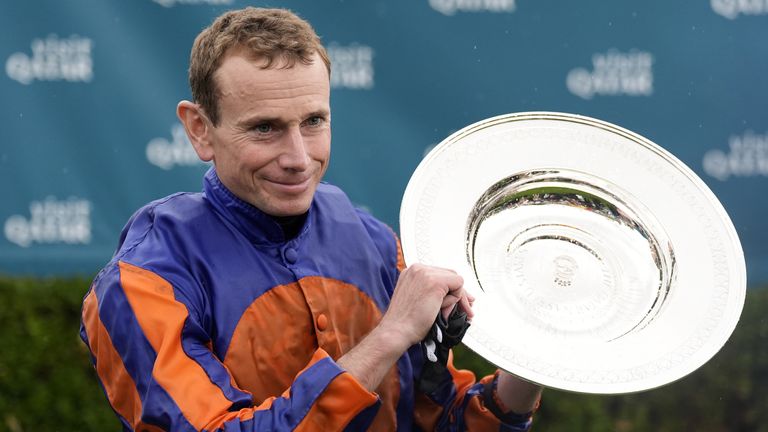 Ryan Moore poses with the Nassau Stakes trophy after guiding Whirl to success