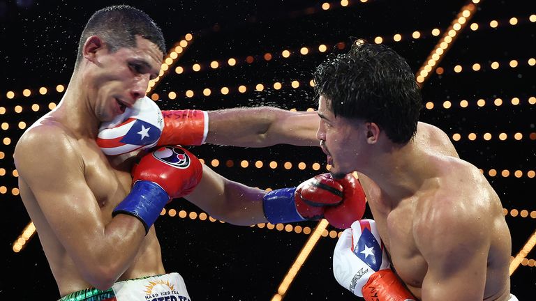 Zayas lands a backhand on Garcia (Photo: Mikey Williams/Top Rank)