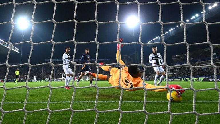 Zion Suzuki of Parma Calcio saves a shot during the Serie A match between Parma and AS Roma