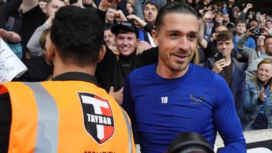 Jack Grealish celebrates with fans after Everton's win at Wolves