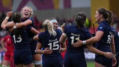 Scotland celebrate after defeating Wales during the group B match at the 2025 Women's Rugby World Cup between Scotland and Wales in Manchester, England, Saturday, Aug. 23, 2025. (AP Photo/Dave Shopland)