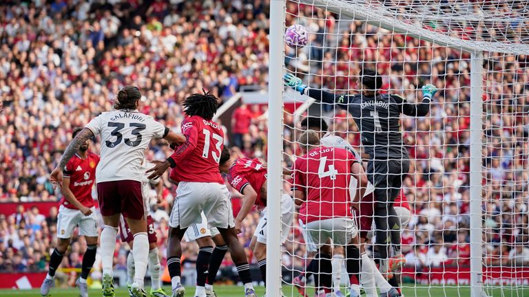 Manchester United's goalkeeper Altay Bayindir fumbled the ball against Arsenal while under pressure from William Saliba