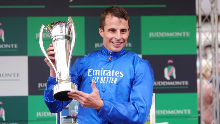 Winning jockey William Buick with the Juddmonte International trophy