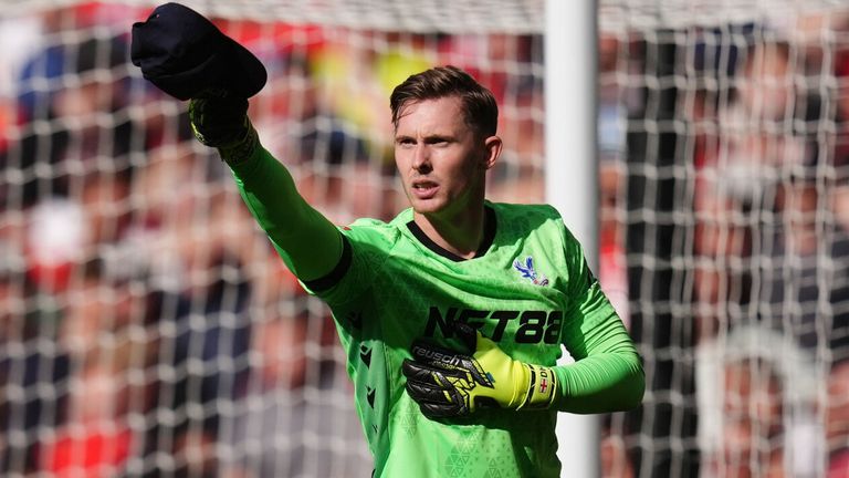 Dean Henderson doffs his cap after saving Alexis Mac Allister's penalty