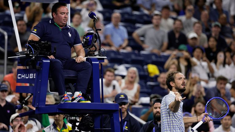 Daniil Medvedev, of Russia, bottom right, reacts next to chair umpire, Greg Allensworth, left, after a photographer ran onto the court durin