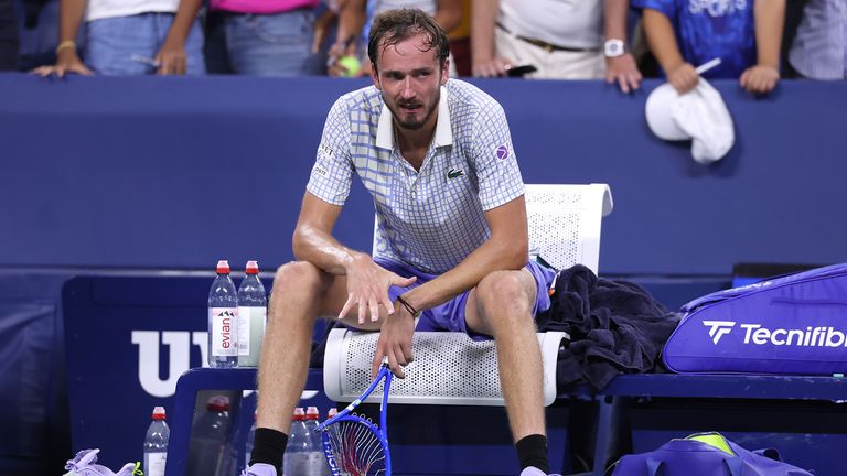 Daniil Medvedev breaks his racket after losing in five sets to Benjamin Bonzi of France during their Men's Singles First Round match on Day 