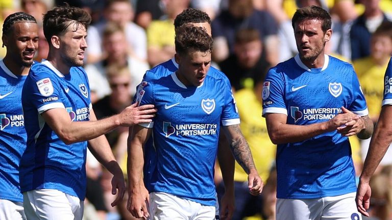 Adrian Segecic is congratulated after opening the scoring for Portsmouth and Oxford