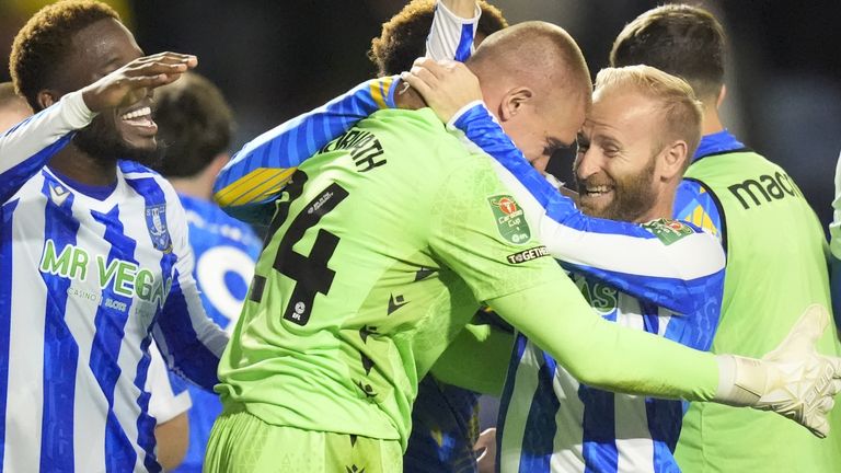 Sheffield Wednesday players Ethan Horvath and Barry Bannan celebrate beating Leeds on penalties in the Carabao Cup second round