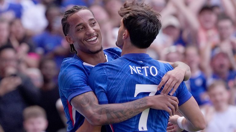 Joao Pedro celebrates with team-mate Pedro Neto after scoring Chelsea's second goal against AC Milan