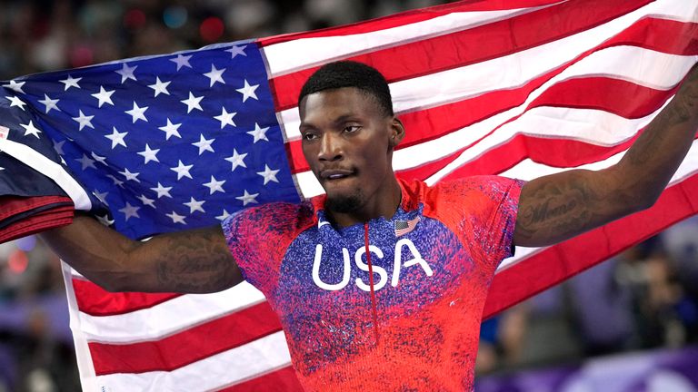 Fred Kerley, of the United States, celebrates after his third place finish in the men's 100-meter final at the 2024 Summer Olympics, Sunday, Aug. 4, 2024, in Saint-Denis, France. (AP Photo/Bernat Armangue)
