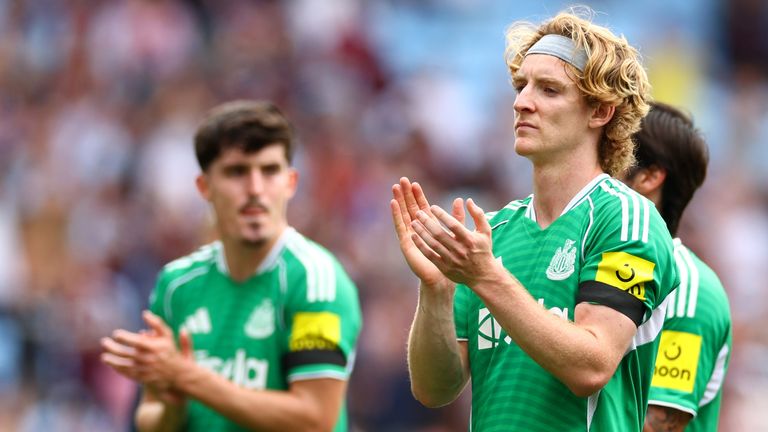 Anthony Gordon applauds the travelling Newcastle fans at Aston Villa
