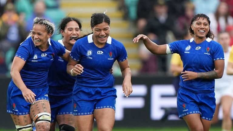 Harmony Vatau is mobbed after scoring Samoa's first points of Rugby World Cup 2025