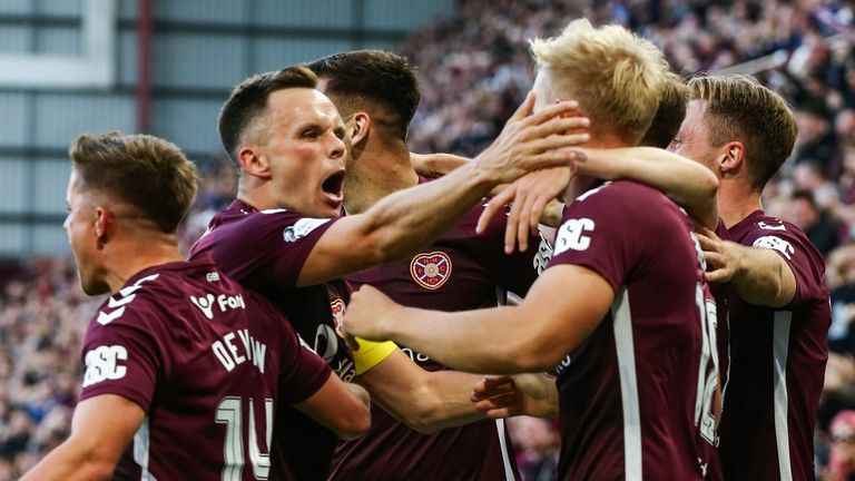 EDINBURGH, SCOTLAND - AUGUST 04: Hearts' Harry Milne (R) and Lawrence Shankland (L) celebrate after Aberdeen's Graeme Shinnie scores an own goal to make it 1-0 during a William Hill Premiership match between Heart of Midlothian and Aberdeen at Tynecastle Park, on August 04, 2025, in Edinburgh, Scotland. (Photo by Ewan Bootman / SNS Group)