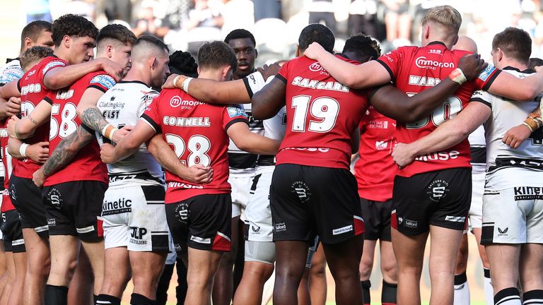 Hull FC and Salford joined together at the end of the contest in a show of solidarity 