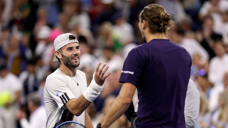 Jacob Fearnley, left, of Great Britain, congratulates Alexander Zverev, of Germany, after he was defeated during the second round of the U.S