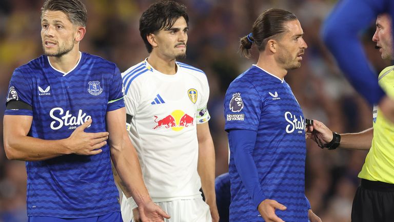 Everton captain James Tarkowski (left) protests after he was penalised for handball to give Leeds a late penalty