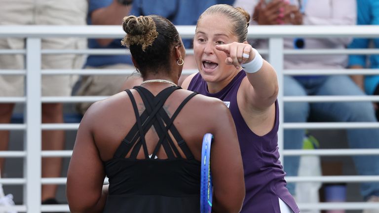 Jelena Ostapenko of Latvia (R) argues with Taylor Townsend of the United States (L) following their Women's Singles Second Round match on Da