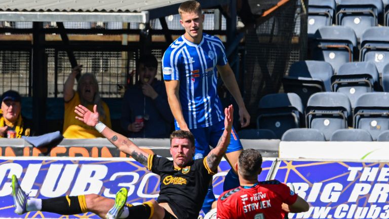 Livingston's Robbie Muirhead is fouled for a penalty by Kilmarnock's George Stanger