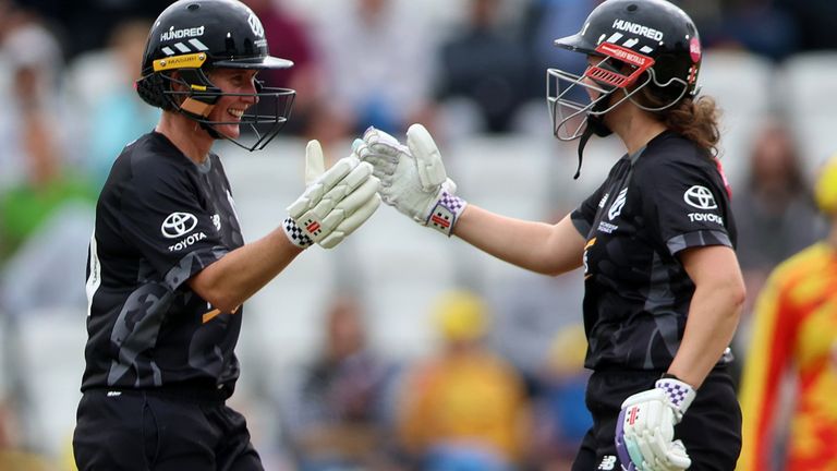 Manchester Originals' Beth Mooney and Kathryn Bryce celebrate after they reach a one hundred run partnership (ECB image)