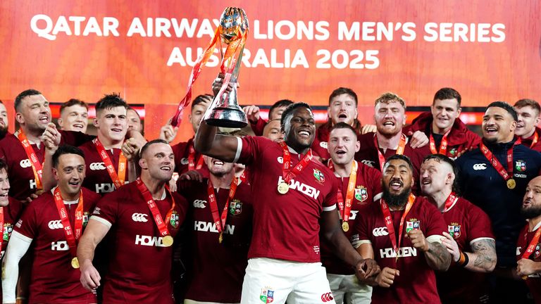 British and Irish Lions' Maro Itoje lifts the trophy as he celebrates with his team-mates 