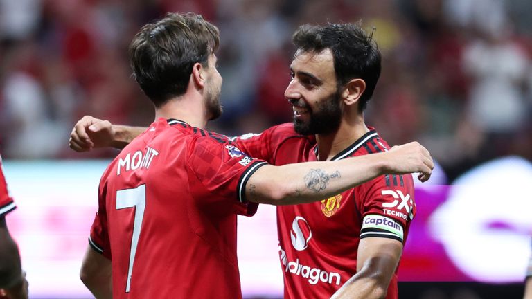 Bruno Fernandes embraces Mason Mount after setting up his goal
