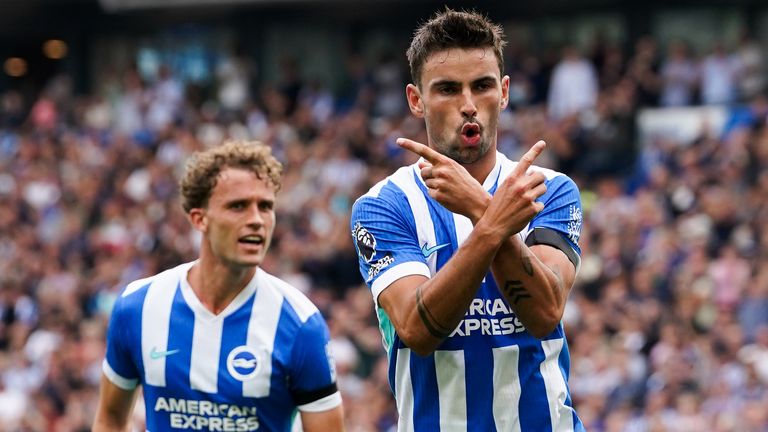 Brighton's Matt O'Riley celebrates scoring the opening goal from the penalty spot 