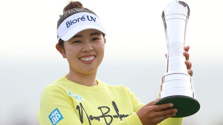 Japan's Miyu Yamashita poses with the trophy after winning the 2025 AIG Women's Open on day four at Royal Porthcawl