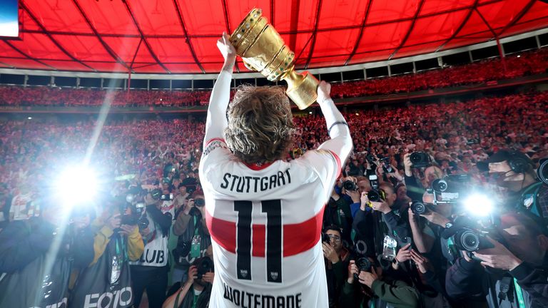 Nick Woltemade with the trophy after winning the DFB-Pokal with Stuttgart