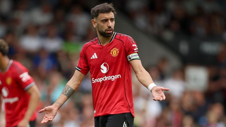 Bruno Fernandes gestures to referee Chris Kavanagh prior to taking - and missing - a penalty against Fulham