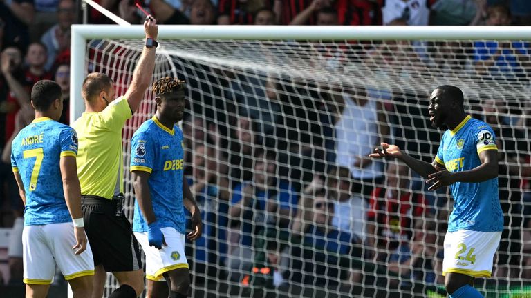 Tote Gomes protests after being shown a red card by referee Thomas Bramall