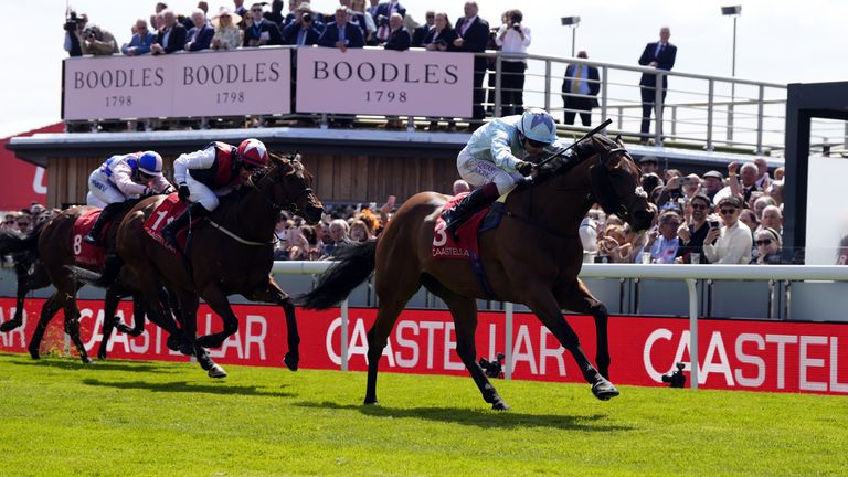 Roman Dragon ridden by Oisin Murphy (right) on their way to winning the CAA Stellar Handicap at Chester Racecourse