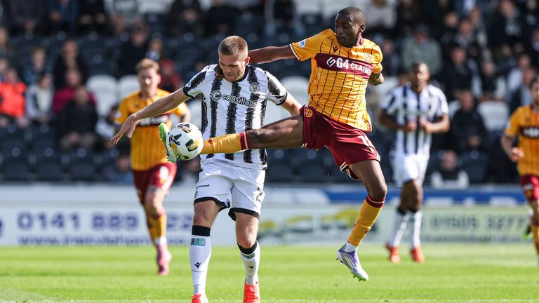 PAISLEY, SCOTLAND - AUGUST 09: St Mirren's Marcus Fraser and Motherwell's Tawanda Maswanhise in action during a William Hill Premiership match between St Mirren and Motherwell at the SMiSA Stadium, on August 09, 2025, in Paisley, Scotland. (Photo by Craig Williamson / SNS Group)