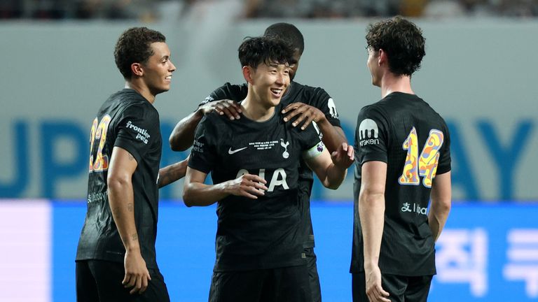 Son Heung-Min of Tottenham is embraced by teammates Brennan Johnson and Archie Gray as he is substituted off having played his final game