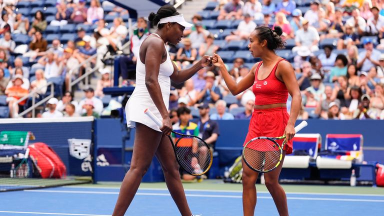 Venus Williams, from the United States, the left, and Lila Fernandez, from Canada, speaks on the field during the marital match in the first round
