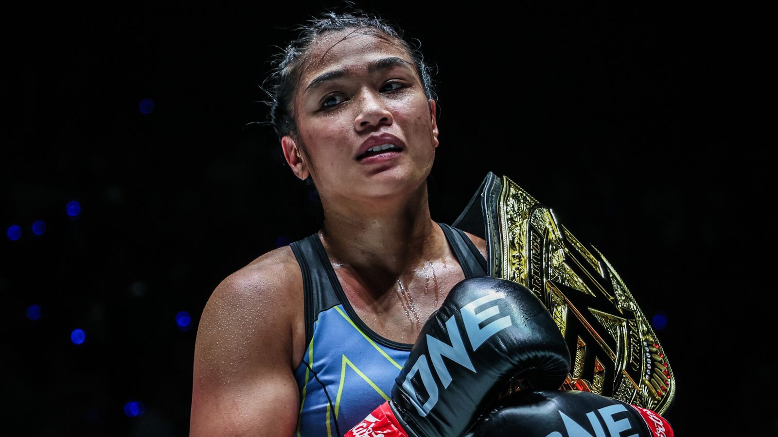 Jackie Buntan posing with championship belt