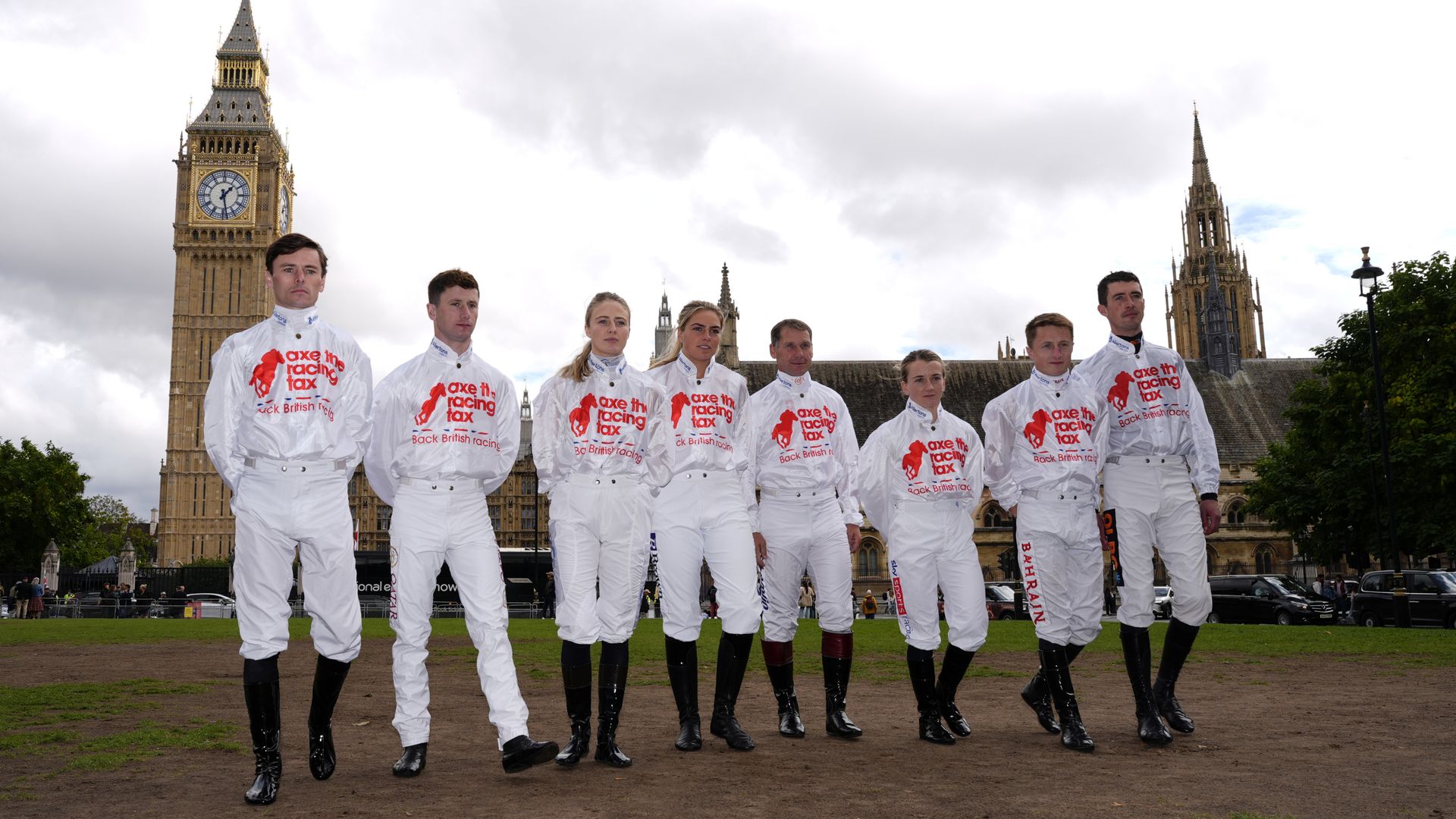 Jockeys stand together in Parliament Square as racing goes on strike