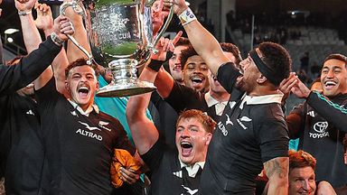 New Zealand's team celebrate with the Bledisloe Cup after their victory during the Rugby Championship match against Australia at Eden Park