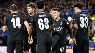 Phil Foden celebrates his goal with his Manchester City team-mates after putting his side ahead against Huddersfield
