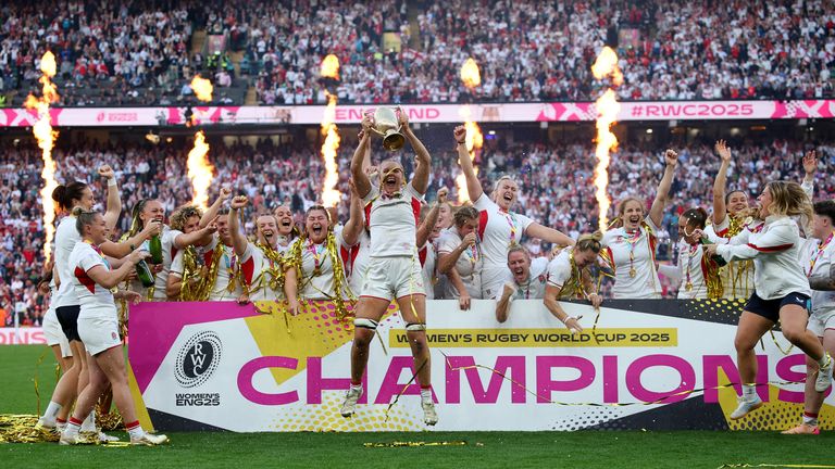 England's Zoe Aldcroft lifts the trophy as she celebrates with teammates after winning the Womens Rugby World Cup final. Pic: Reuters